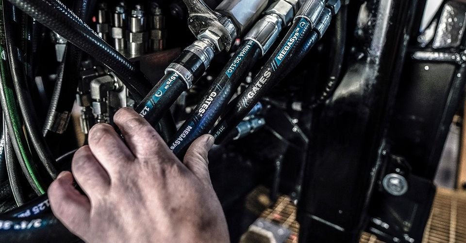 Hydraulic hose service on heavy equipment